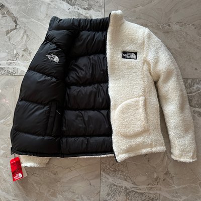 Двухсторонняя зимняя куртка THE NORTH FACE фото