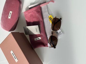 Сонцезахисні окуляри Miu Miu MUA53S ZVN60O Brown/Gold Premium фото
